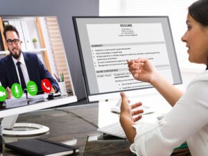 Resume on screen with a zoom session and two people discussing