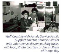 BW image of people packing food boxes